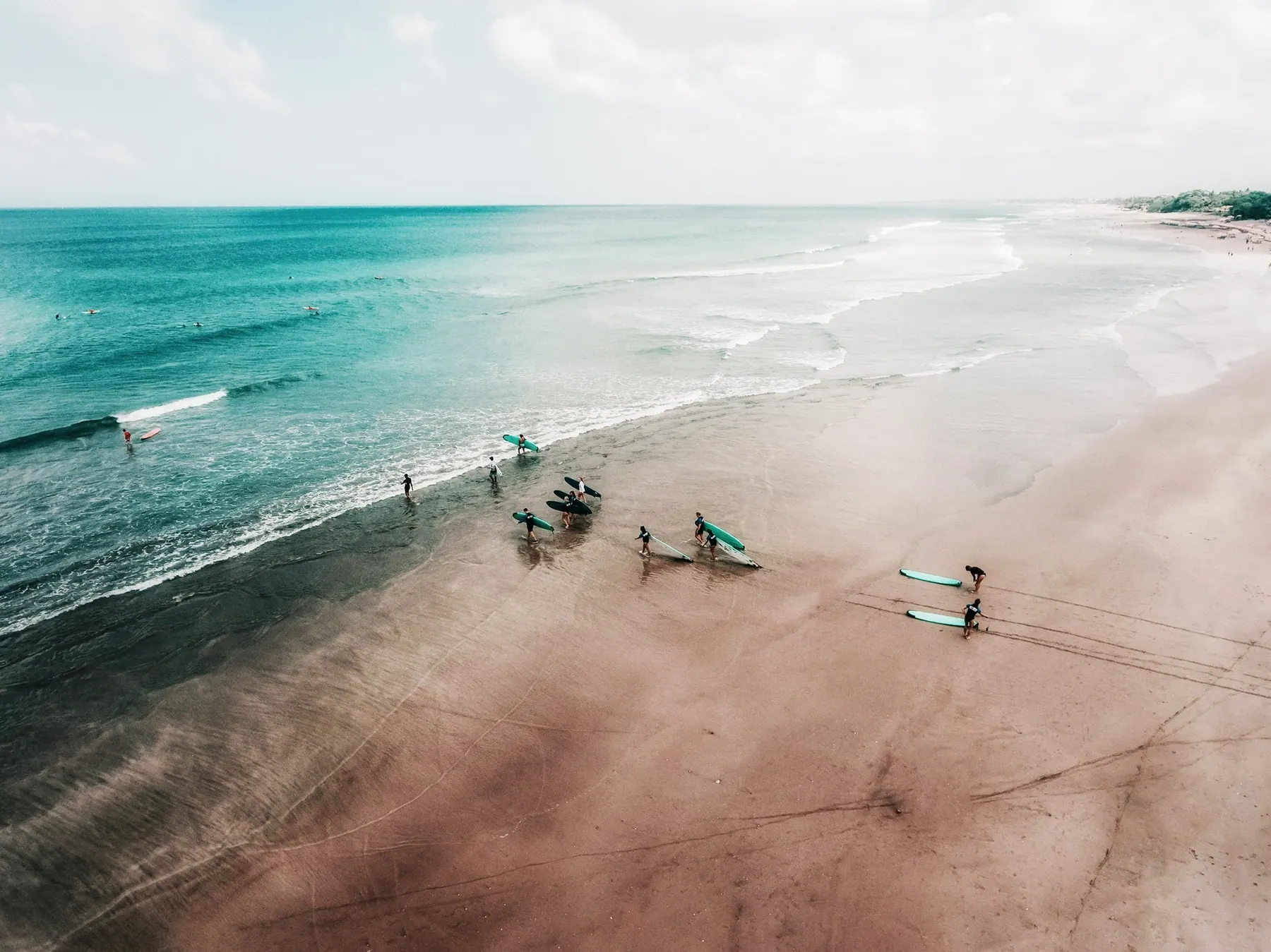 Sports and Physiotherapy students training in the ocean in Bali