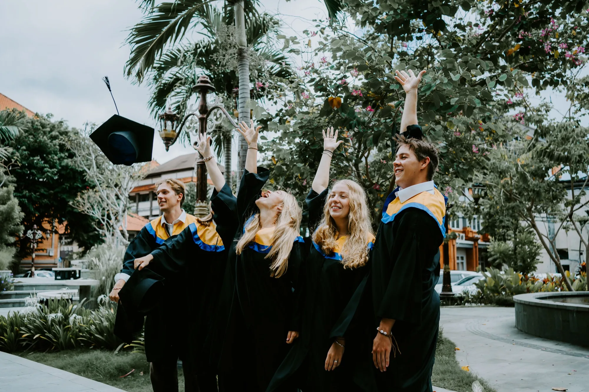 Graduates throwing their caps in the air