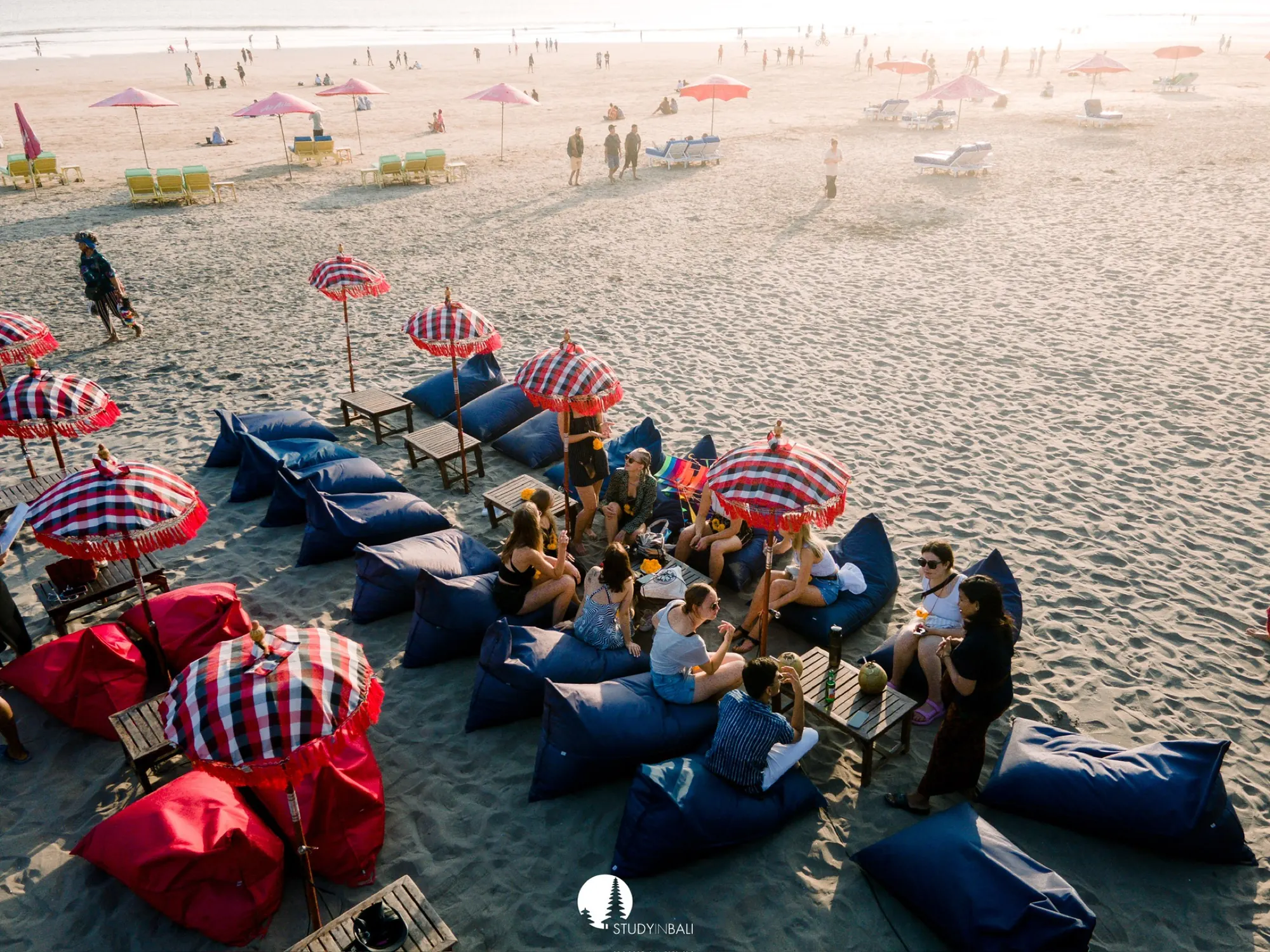 Students on beanbags at the beach